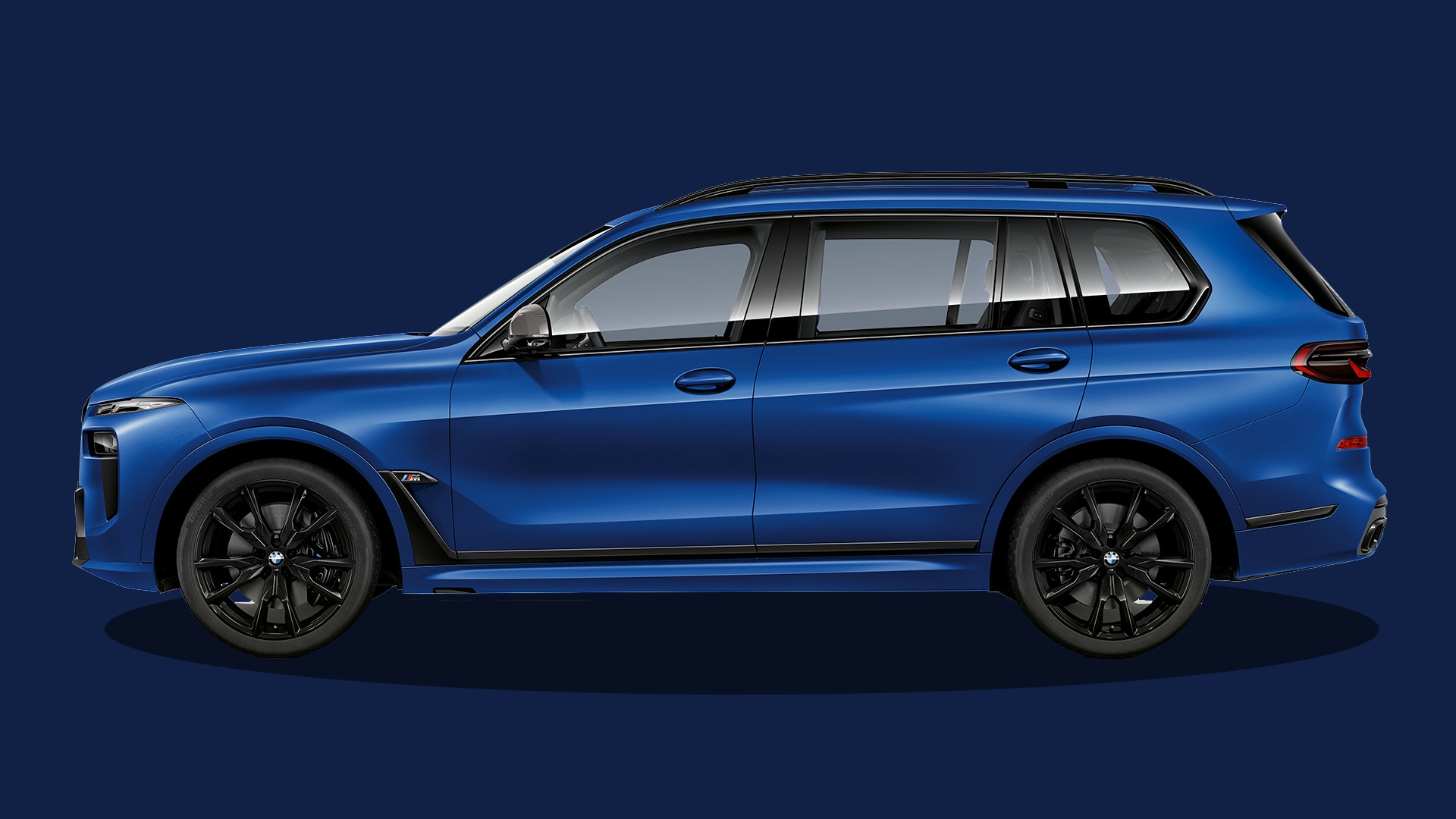 The BMW X7 M60i xDrive in Frozen Portimao Blue Metallic: a luxurious SUV with a powerful presence.