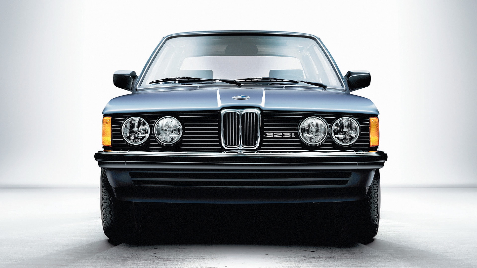 1975: The first BMW 3 Series was available with two or four round headlamps depending on the engine. While the four-cylinder models were equipped with single round headlamps, the six-cylinder variants featured the distinctive four-eyed face.&nbsp;