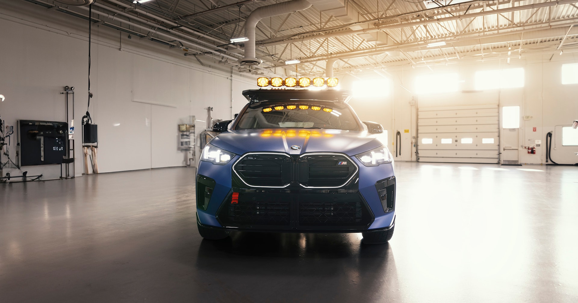 Modifications to the BMW X2 include small steel skid plates added to the front underbody of the BMW and a vertical spare tire holder added to the cargo area.